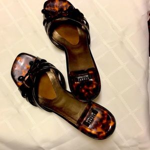 Stuart Weitzman size 6 1/2B tortoise slips with bow detail.
